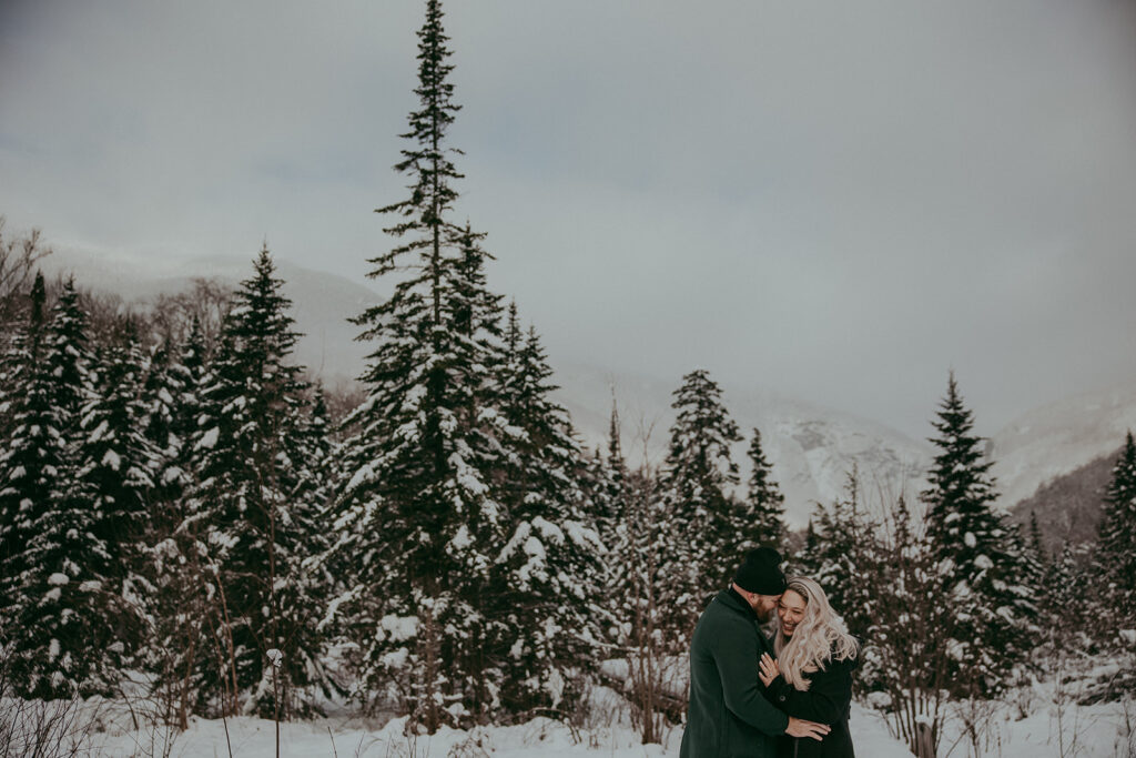Snow covered evergreen Stowe Vermont engagement photo