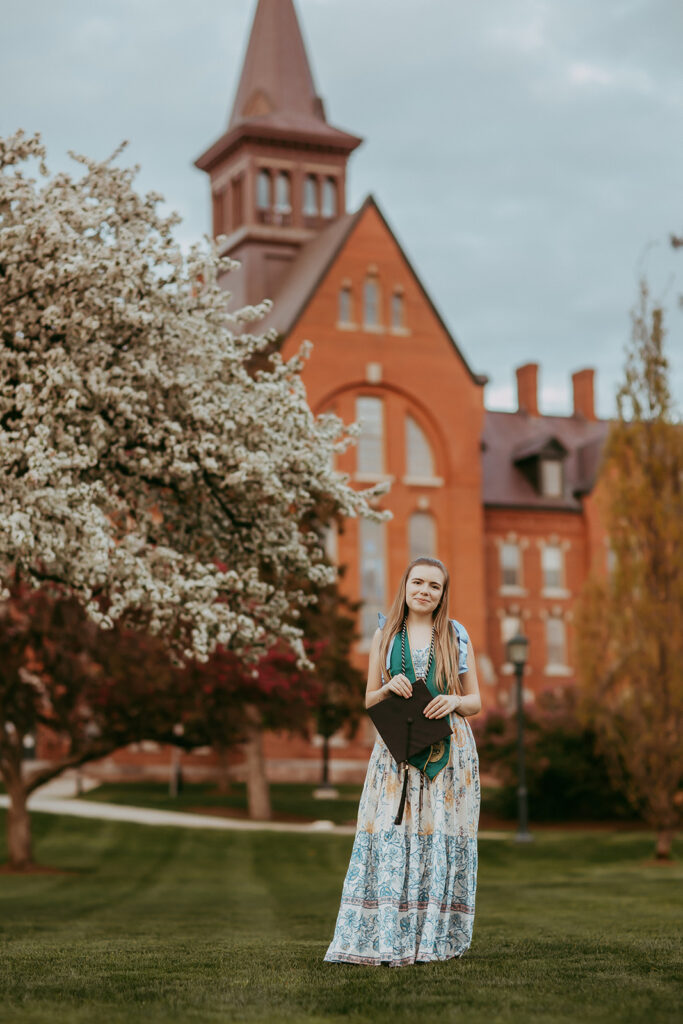 UVM senior portrait with campus architecture